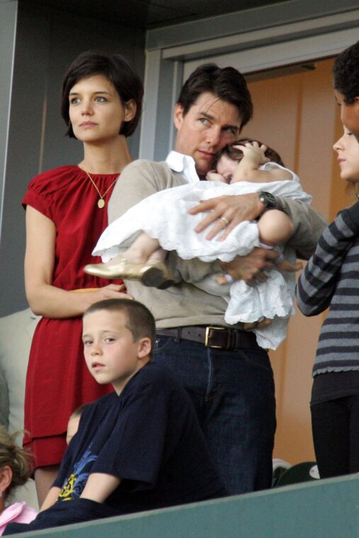 David Beckham's son Brooklyn Beckham (front), actors Tom Cruise and Katie Holmes, with their daughter Suri Cruise, watch a Major League Soccer match on May 10, 2008 in Carson, California | Source: Getty Images