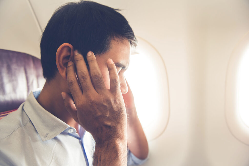 A frustrated male airplane passenger | Source:...<div class=